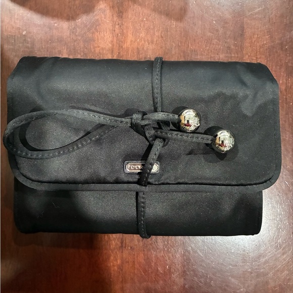 Coach Handbags - Coach Black Travel Jewelry Bag with Silver Tie Details